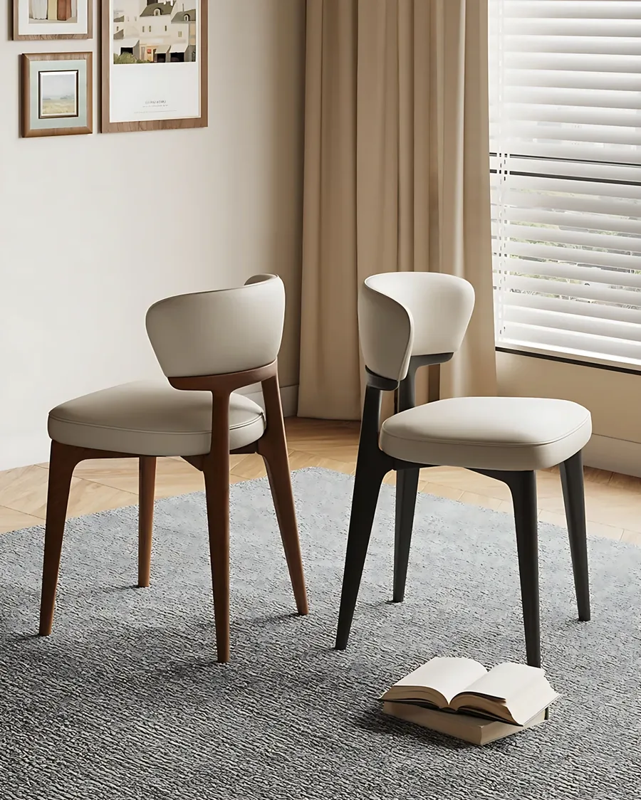 Two dining chairs in a smooth upholstery, shown as a category reference for Eco-Lux