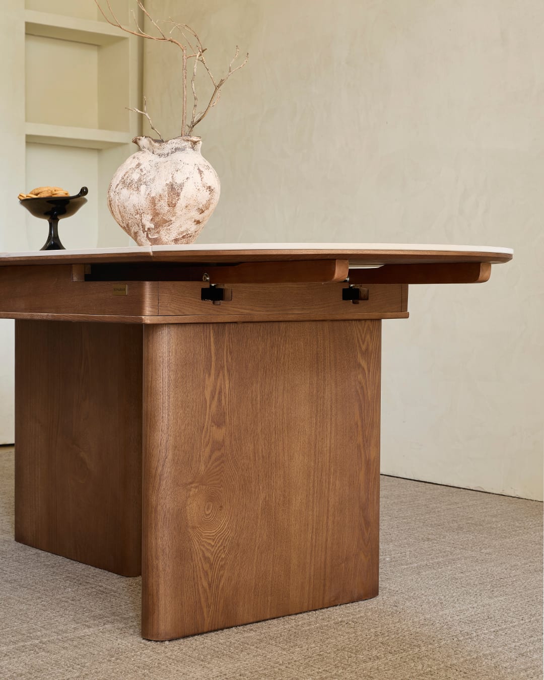 The Alto Extendable’s solid walnut base, close up